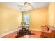Bright office space with wood floors, piano, ceiling fan, and ample natural light at 415 Eldridge Dr, Suwanee, GA 30024