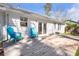 Spacious backyard deck with two blue Adirondack chairs is ideal for relaxation at 4247 Windward Ln, Norcross, GA 30093