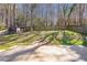 Large backyard with a wood privacy fence and shed provides ample outdoor space at 4247 Windward Ln, Norcross, GA 30093