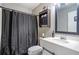 Updated bathroom featuring a vanity and walk-in shower with black shower curtain at 4247 Windward Ln, Norcross, GA 30093