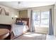 Comfortable bedroom features a queen bed, area rug, and dual windows at 4247 Windward Ln, Norcross, GA 30093