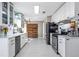Bright and modern kitchen with white cabinets, stainless steel appliances, and ample counter space at 4247 Windward Ln, Norcross, GA 30093