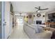 Spacious living room featuring a stone fireplace, ceiling fan, and ample seating at 4247 Windward Ln, Norcross, GA 30093