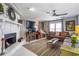 Bright living room featuring a fireplace, large windows, and elegant decor at 4247 Windward Ln, Norcross, GA 30093