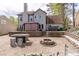 Large backyard with gazebo, stone table with seating, and a fire pit at 539 Riverbirch Trce, Stone Mountain, GA 30087
