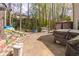 Backyard featuring brick-paved patio area with hot tub and seating at 539 Riverbirch Trce, Stone Mountain, GA 30087