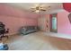 Comfortable bedroom with neutral carpet, ceiling fan, and closet at 539 Riverbirch Trce, Stone Mountain, GA 30087