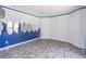 Versatile bonus room with blue and white walls and gray tile flooring at 539 Riverbirch Trce, Stone Mountain, GA 30087