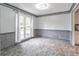 Bright dining room with large window, stone accent walls, and neutral tile flooring at 539 Riverbirch Trce, Stone Mountain, GA 30087