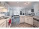 Bright eat-in kitchen with white cabinets, stainless steel appliances, and plenty of natural light at 539 Riverbirch Trce, Stone Mountain, GA 30087