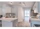 Spacious kitchen featuring modern backsplash, stainless steel appliances, and ample counter space at 539 Riverbirch Trce, Stone Mountain, GA 30087
