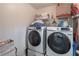 Laundry room with modern Samsung washer and dryer units at 539 Riverbirch Trce, Stone Mountain, GA 30087