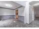 Spacious living room with stone accent walls, crown molding, and gray tile flooring at 539 Riverbirch Trce, Stone Mountain, GA 30087
