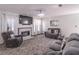Comfortable living room featuring a fireplace, plush seating, and decorative lighting at 539 Riverbirch Trce, Stone Mountain, GA 30087