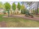 Community playground with swings, slide, and lush surroundings at 539 Riverbirch Trce, Stone Mountain, GA 30087