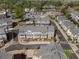 An aerial view of the townhomes featuring craftsman style design with gray roofing and a walkable community at 825 Maplewood Dr, Roswell, GA 30075