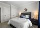 Comfortable bedroom featuring a queen bed, soft carpet, and neutral colors for a relaxing atmosphere at 825 Maplewood Dr, Roswell, GA 30075