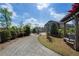 Serene community area featuring a pergola swing, seating and lush greenery at 825 Maplewood Dr, Roswell, GA 30075