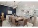 Bright dining room featuring modern light fixtures, decor and hardwood flooring throughout at 825 Maplewood Dr, Roswell, GA 30075