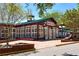Roswell Mill building featuring large windows, red brick accents, and manicured landscaping at 825 Maplewood Dr, Roswell, GA 30075