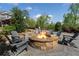 Cozy outdoor fire pit area with seating and surrounding greenery, great for gatherings at 825 Maplewood Dr, Roswell, GA 30075