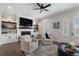Comfortable living room featuring a fireplace, built-in shelving, and cozy seating, with double doors to outdoor views at 825 Maplewood Dr, Roswell, GA 30075