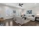 Bright living room features a plush sofa, stylish chairs, and abundant natural light at 825 Maplewood Dr, Roswell, GA 30075