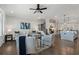 Open-concept living room with hardwood floors, neutral decor, and a staircase nearby at 825 Maplewood Dr, Roswell, GA 30075