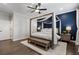 This main bedroom offers a canopy bed, ceiling fan, and a cozy rug at 825 Maplewood Dr, Roswell, GA 30075