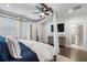 Bright main bedroom featuring a canopy bed, wood floors, and large windows at 825 Maplewood Dr, Roswell, GA 30075