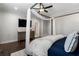 The main bedroom boasts a canopy bed and an elegant ceiling fan at 825 Maplewood Dr, Roswell, GA 30075