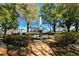 Picturesque park featuring a fountain, lush greenery, and walking paths, perfect for relaxation and enjoying nature at 825 Maplewood Dr, Roswell, GA 30075