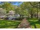 Scenic park gazebo on a lush lawn with mature trees, providing a peaceful and inviting outdoor space at 825 Maplewood Dr, Roswell, GA 30075