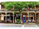 Charming restaurant exterior with outdoor seating and a vibrant blue entrance door at 825 Maplewood Dr, Roswell, GA 30075