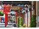 Inviting shopping district featuring unique boutiques, outdoor seating, and decorative lighting at 825 Maplewood Dr, Roswell, GA 30075