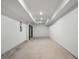 Unfinished basement with concrete floor, white walls, and recessed lighting ready for customization at 2328 Mason Drive Dr, Atlanta, GA 30316