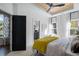 Bright bedroom featuring a tray ceiling with fan and lots of natural light at 2328 Mason Drive Dr, Atlanta, GA 30316