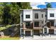 Contemporary townhome exterior featuring private balconies and landscaped front yard at 2328 Mason Drive Dr, Atlanta, GA 30316