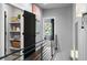 Bright hallway with iron railing, open shelving, and views into other rooms through open doorways at 2328 Mason Drive Dr, Atlanta, GA 30316