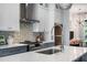 Modern kitchen features stainless steel appliances, gray cabinets, and a mosaic backsplash at 2328 Mason Drive Dr, Atlanta, GA 30316