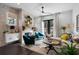 Bright living room with brick fireplace, dark hardwood floors, and comfortable seating at 2328 Mason Drive Dr, Atlanta, GA 30316
