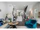 Bright living room with a view to the kitchen and staircase, with stylish furniture at 2328 Mason Drive Dr, Atlanta, GA 30316