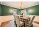 Stylish dining room with a rustic wood table and chic decor at 3664 Bonnie Glenn Ln, Tucker, GA 30084