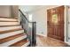 Inviting entryway with hardwood floors, staircase, and a stained-glass accent door at 3664 Bonnie Glenn Ln, Tucker, GA 30084