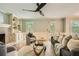 Well-lit living room with hardwood floors, a fireplace, and plenty of natural light at 3664 Bonnie Glenn Ln, Tucker, GA 30084
