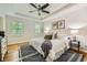 Cozy main bedroom featuring neutral decor, tray ceiling and hardwood floors at 3664 Bonnie Glenn Ln, Tucker, GA 30084