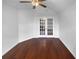 Vaulted bedroom with hardwood floors and glass paneled doors at 409 Kenley Ct, Mcdonough, GA 30253