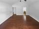 Open concept bedroom with hardwood floors, fan, and an adjoining bath and closet at 409 Kenley Ct, Mcdonough, GA 30253