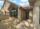 Charming stone exterior with arched window, shutters, and inviting front porch creates curb appeal at 409 Kenley Ct, Mcdonough, GA 30253