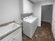 Convenient laundry room with modern washer, dryer, sink and plenty of cabinet storage at 409 Kenley Ct, Mcdonough, GA 30253